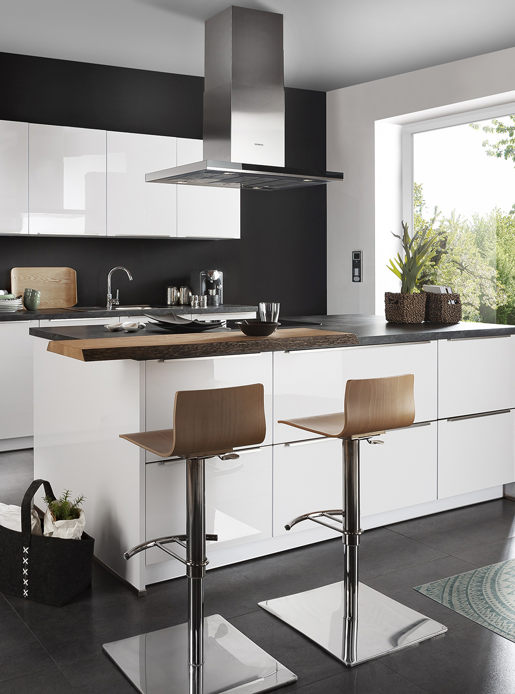 Contemporary German kitchen with island and bar stools